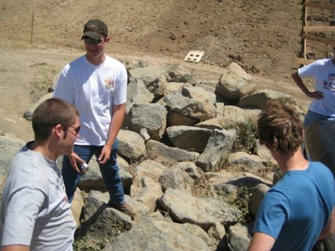 1989 Ford Bronco - Group of friends gathered outdoors near a rocky embankment.