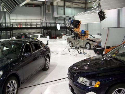 1971 Ford Ranchero - Cars are positioned in a studio environment with professional lighting equipment visible.
