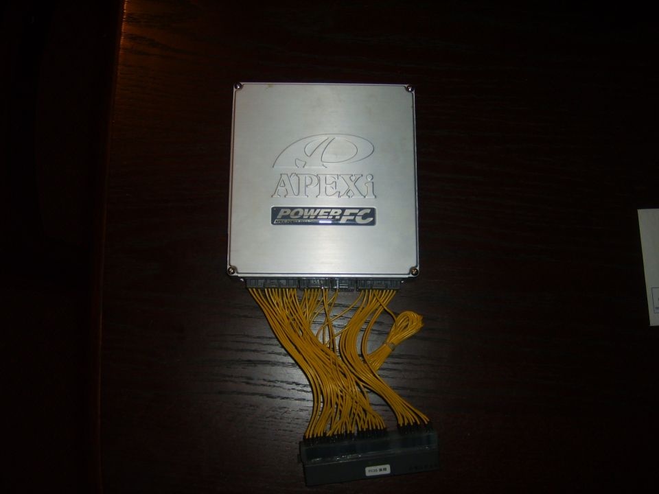 APEXi Power FC engine control unit with yellow wiring harness