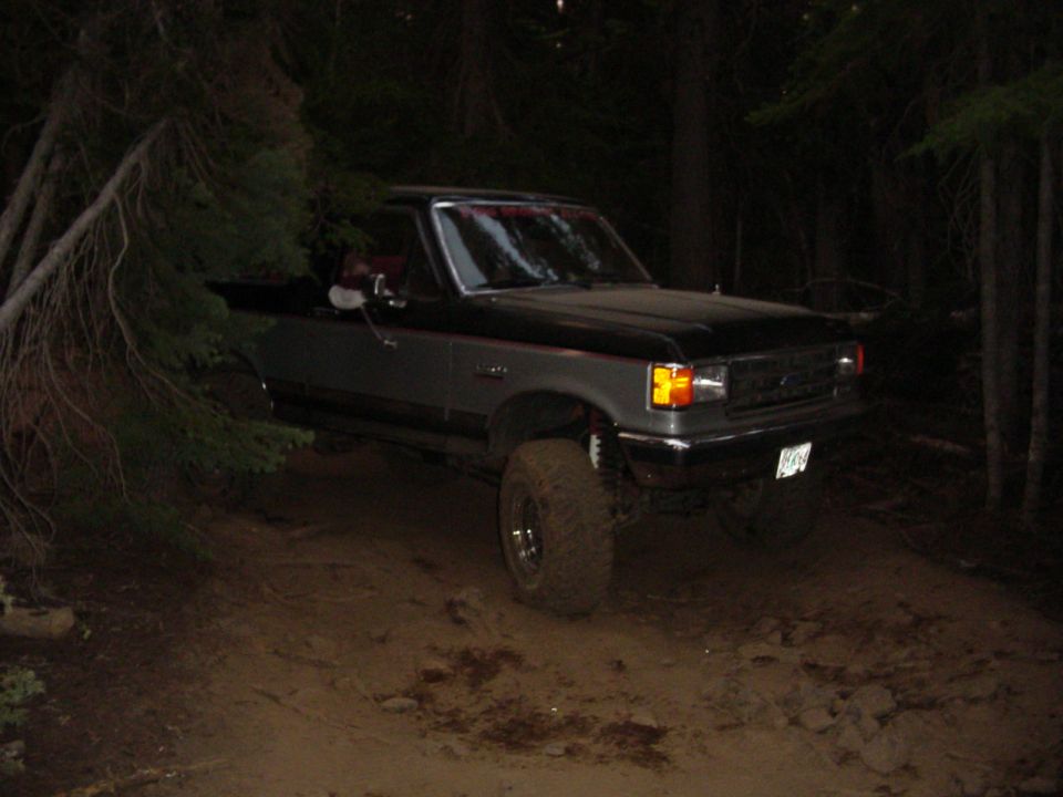 Around a tree with the boy riding shotgun