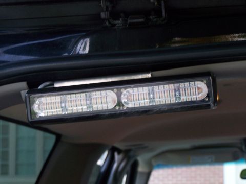 2003 Ford Crown Victoria - An interior light bar is mounted to the headliner of the vehicle.