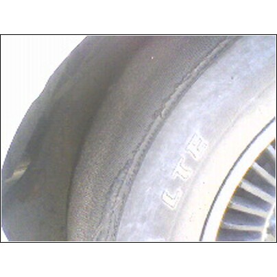1972 Ford Ranchero - A close-up view of a tire, showing the sidewall with 'LTH' text and part of the wheel rim.