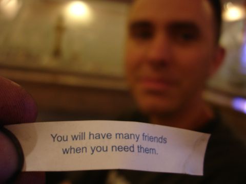 1993 Ford Taurus - A person holds a fortune cookie message that reads, "You will have many friends when you need them."