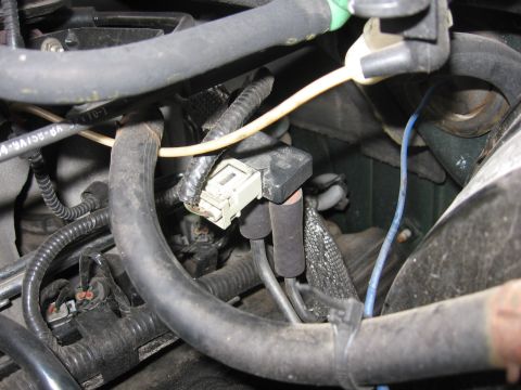 2001 Ford F-150 - Engine bay detail showing a sensor connected to various hoses and electrical wiring.