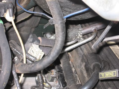 2001 Ford F-150 - Engine bay details including hoses, wiring, and an "ENGINE OIL" cap are visible in this close-up shot.