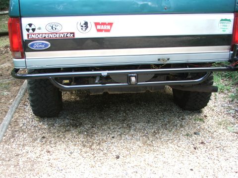 1996 Ford Bronco - Rear view of a 1996 Ford Bronco, showing the bumper, tire, and tailgate details.