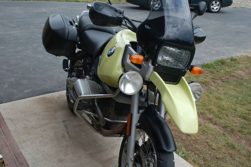Front-right view of yellow-green BMW GS motorcycle with boxer engine and side case