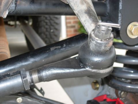 1995 Ford Bronco - This image shows a close-up view of the steering linkage and suspension parts of a vehicle.