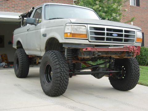 1995 Ford Bronco - This modified 1995 Ford Bronco features a significant lift kit and oversized tires for off-road capability.
