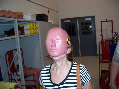 1971 Ford Ranchero - A person wears a pink crash test dummy head, obscuring their face.