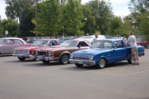 1967 Ford Ranchero - A blue 1964 Ford Falcon pickup truck is parked in a lot with other vehicles.