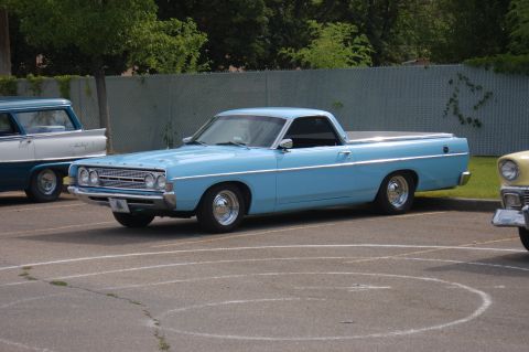1967 Ford Ranchero - A light blue 1967 Ford Ranchero is parked next to another vehicle.