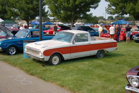 1967 Ford Ranchero - This two-tone pickup truck, likely from the early 1960s, is displayed at an outdoor car show.