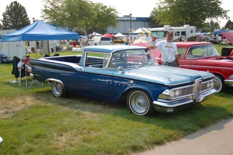 1967 Ford Ranchero - A blue 1959 Ford Fairlane Ranchero is displayed at an outdoor car show with a red car beside it.