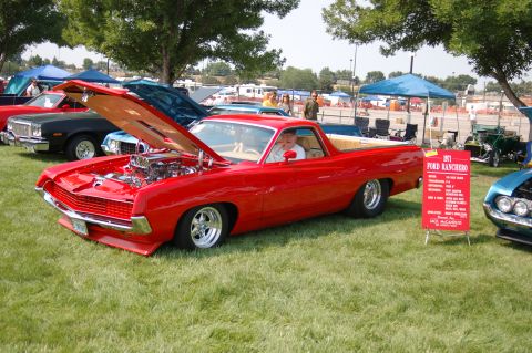 1967 Ford Ranchero - A red 1971 Ford Ranchero is displayed with its hood open at an outdoor car show.