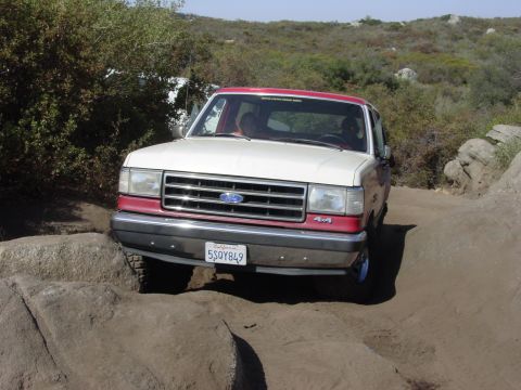 1994 Ford Bronco - This two-tone Ford Bronco navigates a rocky trail.