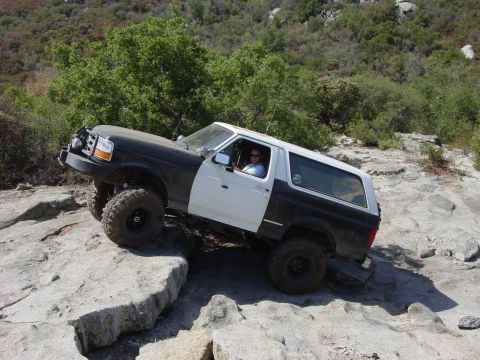 1994 Ford Bronco - This two-tone Ford Bronco navigates a rocky off-road course.