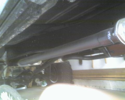 1979 Ford F-250 - Undercarriage view of a truck, focusing on the exhaust system and rear axle components.