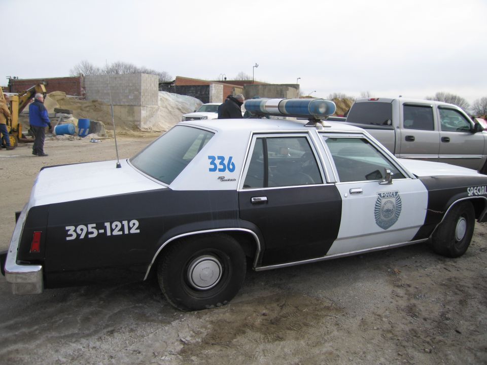 1991 Ford Crown Victoria LTD police car, side view, black and white livery with number 336