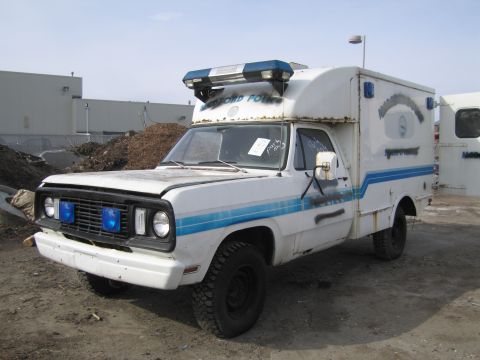 1991 Ford LTD Crown Victoria - This white truck, marked "Medford Police", features a camper shell and blue stripes, suggesting it was a specialized vehicle.