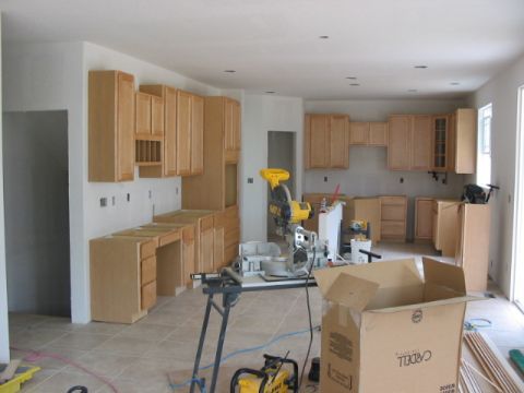 1995 Ford Bronco - A kitchen is shown during its construction phase, unfinished cabinets and various power tools.