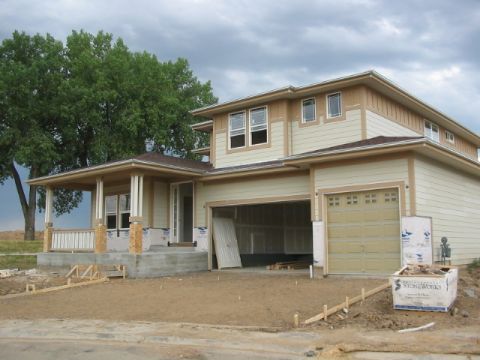 1995 Ford Bronco - A house is being built, with framing visible and materials on site.