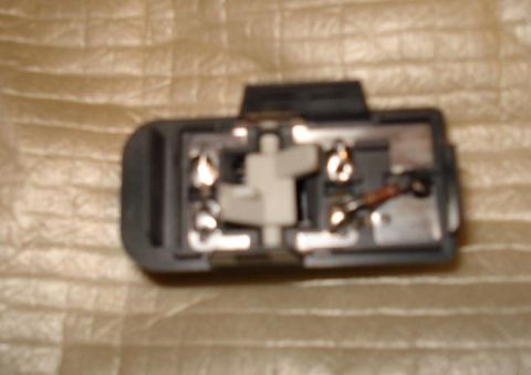 1999 Ford Crown Victoria - Showing under the top section of the switch. The resistor for the LEDs and the LED leads are soldered on here too. (resistor is on the posi…