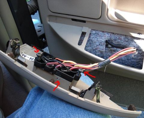 1999 Ford Crown Victoria - With the trim popped off the switch is removed by 2 screws and then releasing 2 locking tabs (one on each side) and slide the switch out