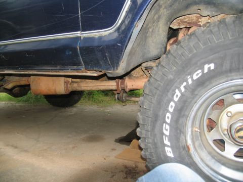 1978 Ford Bronco - Close-up of the rear axle and exhaust system on a 1978 Ford Bronco.