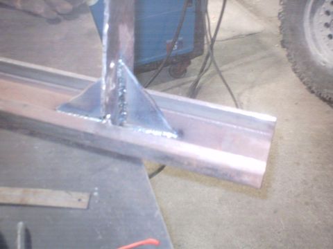 1990 Ford Ranger - A close-up view shows a metal bracket welded onto a steel beam, likely part of a bumper repair or fabrication project.