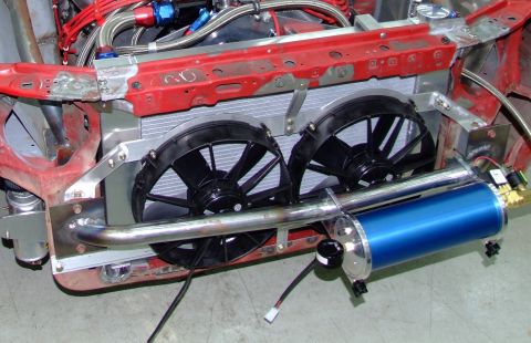 1990 Ford Mustang - Custom engine bay setup dual electric fans and a blue canister, likely for cooling or fluid storage.