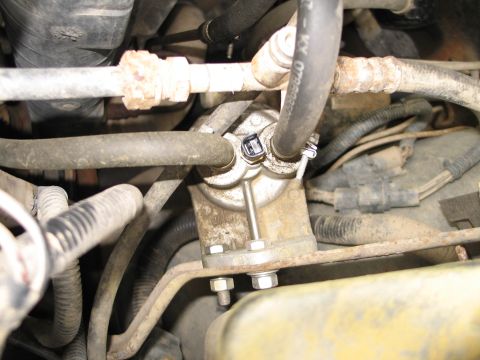 1995 Ford Bronco - Fuel filter assembly with hoses attached, showing mechanical components and connections.