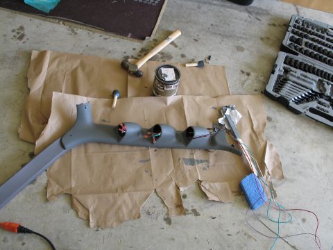 1995 Ford Bronco - A custom gauge pod is laid out with tools and wiring, ready for installation.