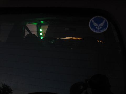 1995 Ford Bronco - Interior view showing green lights and a U.S. Air Force sticker on the rear window.