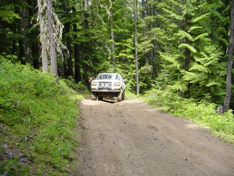 1989 Ford Bronco - A little ways down the road we found another group on the way up the hill, this shows Mark on a hill on a side road