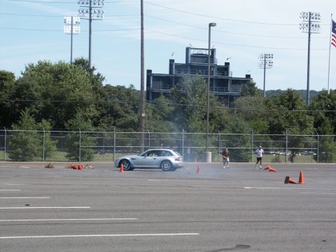 2001 Mercury Grand Marquis - A silver BMW Z3 M Coupe is seen on a paved lot during an event, with orange cones marking a course.