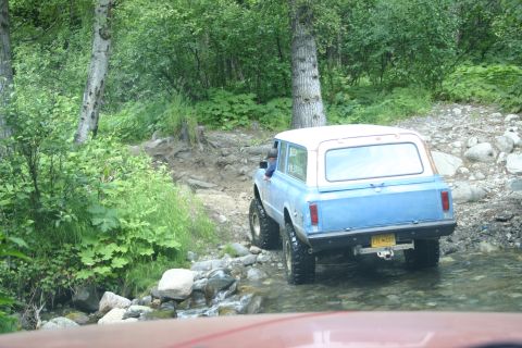 2003 Jeep TJ - This SUV is navigating a rocky stream on an off-road trail.