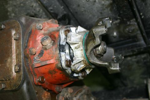 2003 Jeep TJ - This image shows a close-up view of a driveshaft yoke attached to a differential, likely during maintenance or repair.
