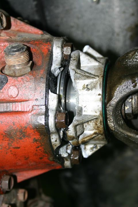 2003 Jeep TJ - This image shows a close-up view of a damaged differential housing and its connection to the driveshaft.