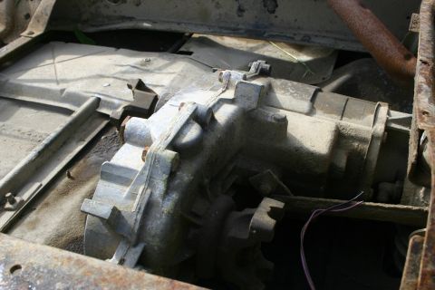 2003 Jeep TJ - Close-up of a vehicle's transfer case, showing mechanical components and wiring.