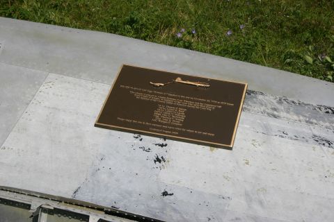 2003 Jeep TJ - Memorial plaque dedicated August 2004 on a metal surface, likely part of an aircraft.
