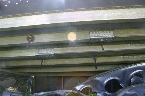 2003 Jeep TJ - Detail of a metal structure with visible rivets and bolts, suggesting a component or frame.