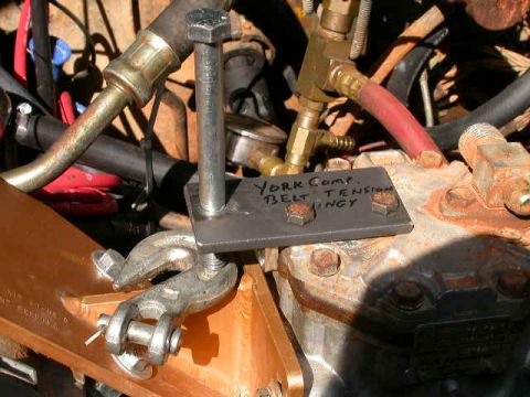 1990 Ford Bronco - Your compressor belt tensioning tool bolted onto compressor