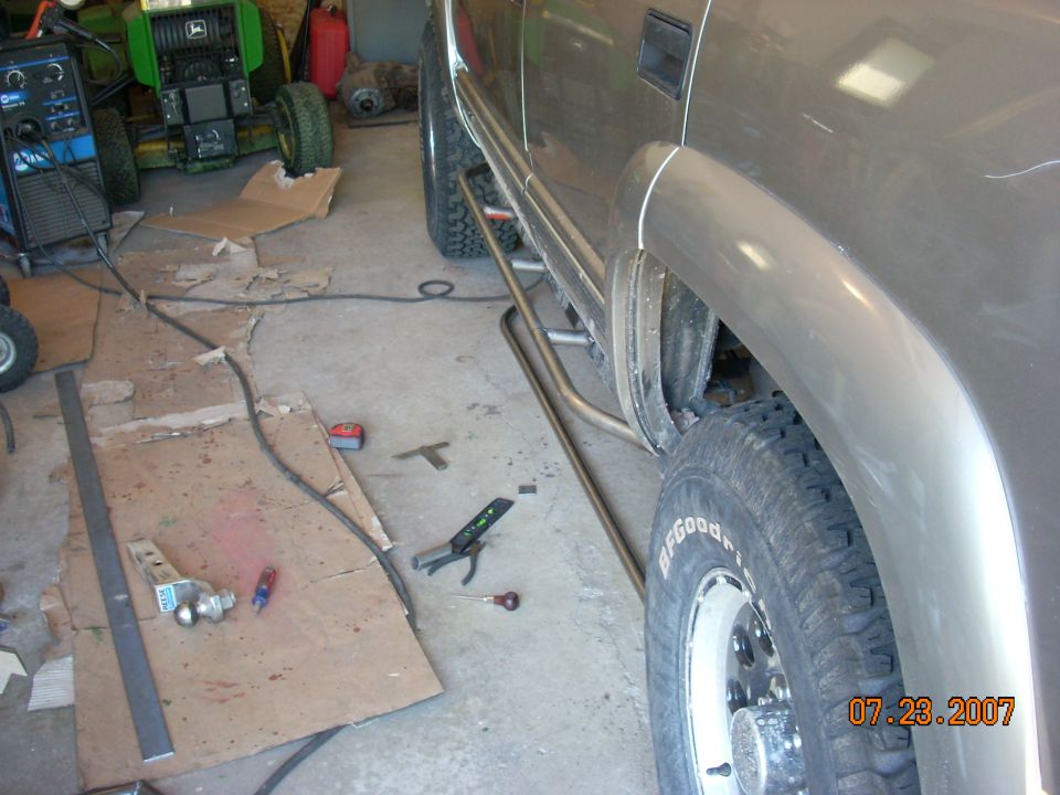 2000 Chevrolet Tahoe side view showing custom rock sliders installed