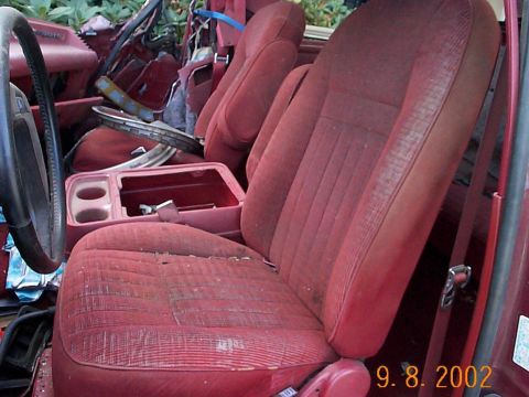 1989 Ford Bronco - Seats and console in the parts bronco,no lid, passenger seat is crushed, seat track is mangled. (pic from Ken K.)
