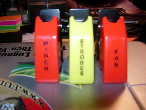 1993 Ford Bronco - Three auxiliary switches are shown, labeled for winch, strobes, and fan functions.