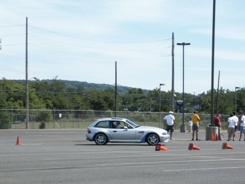 2001 Mercury Grand Marquis - Silver BMW Z3 coupe at an autocross event on a sunny day.