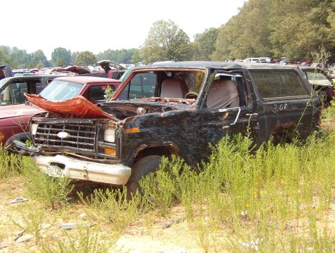 1983 Ford Bronco - Brown's '84 Rustbucket. Red dash, van seats, black trim.