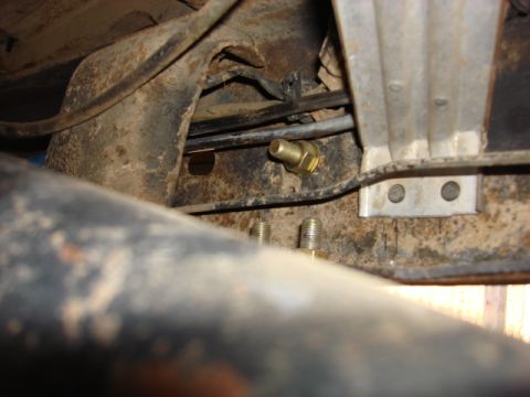 1983 Ford Bronco - since i was now able to connect the lines i drilled the front frame to hold the mounting bracket for the fuel lines.