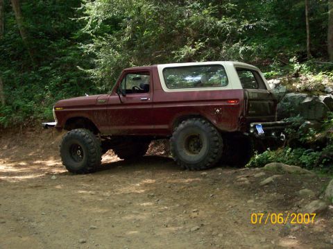 1978 Ford Bronco - This 1978 Ford Bronco is equipped with large off-road tires and appears to be navigating a rocky trail.